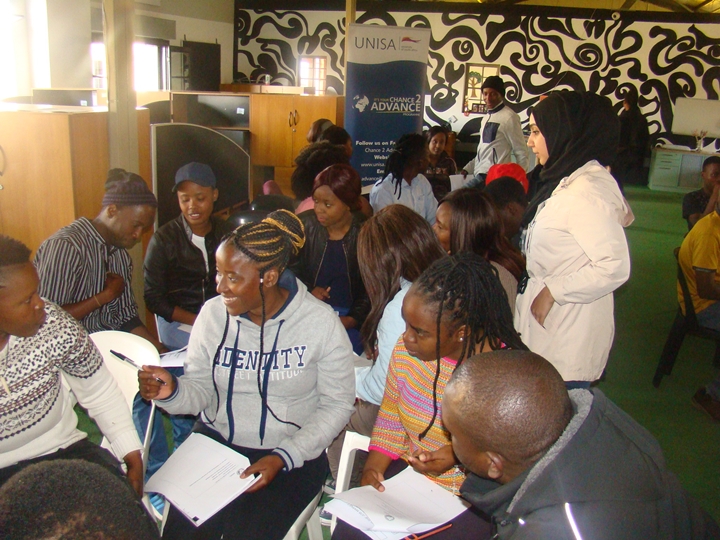 Facilitator Mrs Sumaiyah Fuad Mohammed engaging with the participants during group work